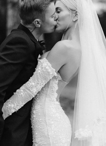 Justin with her wife on their wedding day